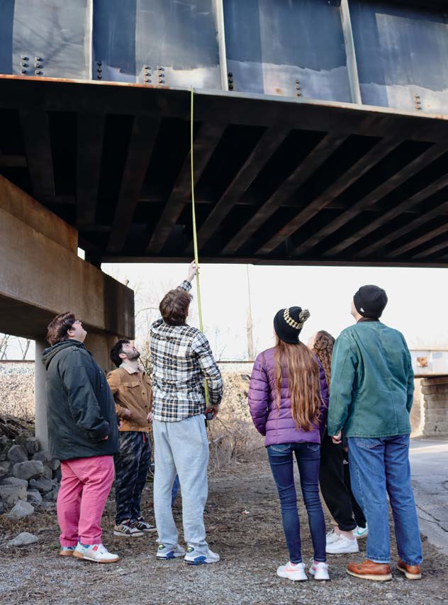 A student team takes measurements for the Big 4 Trail project as part of the senior design capstone course.